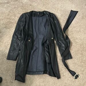 Long, faux leather coat, with waist belt.